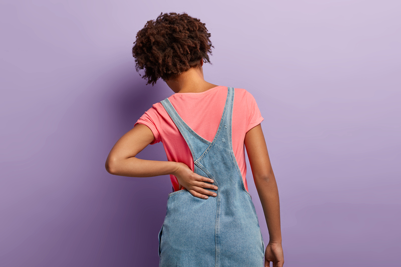 sintomas de dor no coccix